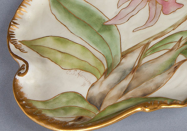 Three piece set plus companion Orchid tray. Tea pot, sugar, and creamer all hand-painted with morning glories by Mrs. Caroline Scott Harrison in pastel tones, green leaves and gold trim. Tea pot and sugar bowl have lids and gold twig like handles. The Orchid tray is done in matching tones and style.