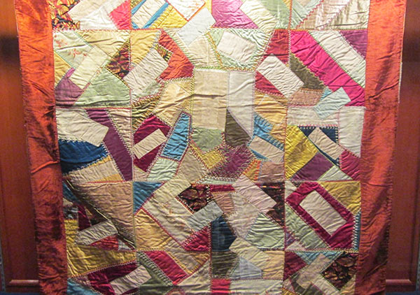 Crazy quilt with velvet boarder, mostly silk fabric in the pattern. Signatures include, Rutherford B. Hayes, Mrs. James K. Polk, John Wanamaker, Julia D. Grant, W. T. Sherman / general, Benj. Butterworth / Ohio, Agnes Author McElroy, Grover Cleveland, Frances Cleveland, T. DeWitt Talmage, and John J. Ingalls.