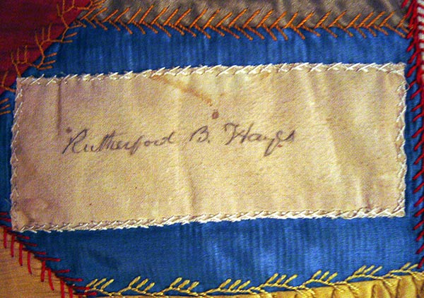 Crazy quilt with velvet boarder, mostly silk fabric in the pattern. Signatures include, Rutherford B. Hayes, Mrs. James K. Polk, John Wanamaker, Julia D. Grant, W. T. Sherman / general, Benj. Butterworth / Ohio, Agnes Author McElroy, Grover Cleveland, Frances Cleveland, T. DeWitt Talmage, and John J. Ingalls.
