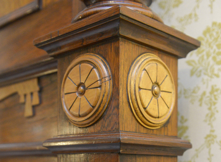 Original Harrison large rosewood and satinwood Renaissance Revival bed. Satinwood panel in tall head board. Large Egyptian medallion in center of head board that matches smaller medallions in chairs. The head board is 8 feet tall with squared feet. Squared urn design on foot board. Foot board has round massive legs. Ornamental pieces in medallions, scrolls, etched designs, etc.