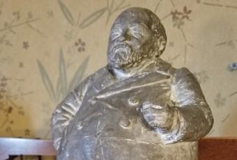 Plaster statue of Benjamin Harrison. Caricature of Benjamin Harrison made by Frank Allen Jr. circa 1895 - 1900. White plaster with a light gray paint coating. On back of base 