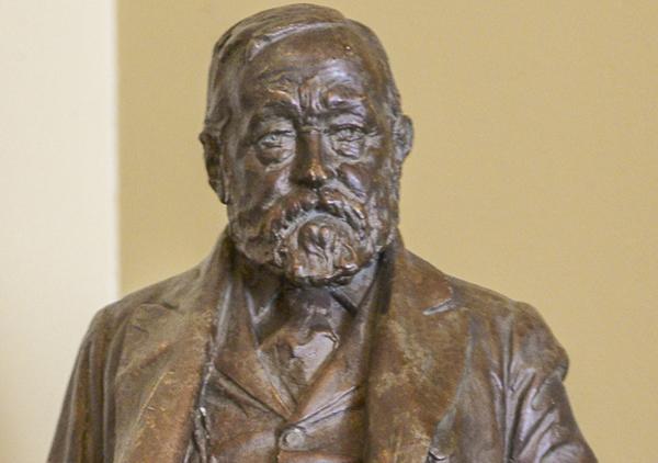 Full length figure of Benjamin Harrison cast in plaster done by Charles Henry Niehaus. Model for the statue in University Park, Indianapolis, IN. This plaster model is painted to appear like bronze. Harrison is holding a top hat in his right hand and his over coat is draped over his left arm. His left leg is forward giving the statue a walking stance.