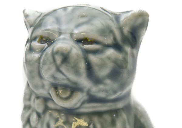 Cat figurine that says 