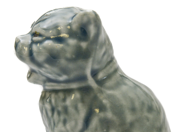Cat figurine that says 