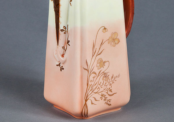 Photo of Square pot with pink and rose colors blended into cream and white upper part, gold butterflies, brown handle & spout. Initials 