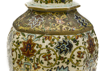 Matched pair of porcelain rose jars (Potpourri jars) with octagon shape, so called as they were filled with dried rose petals. They are Hungarian and have a gold lion on top. The lions are painted with a rough finish gold paint. They have their mouths open and one paw up on a bright and smooth gold ball. Ornately painted with red, blue, and dark yellow flowers with green leaves and vines on white background with gold trim at top.