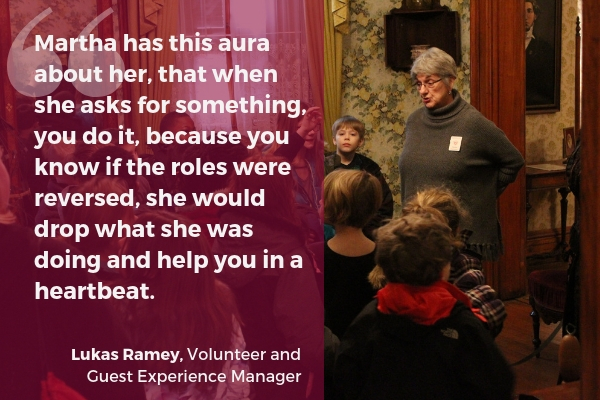Image of Martha Buehner leading a children's tour, followed by a quote from Lukas Ramey, Volunteer and Guest Experience Manager. The quote reads, "Martha has this aura about her, that when she asks for something, you do it, because you know if the roles were reversed, she would drop what she was doing and help you in a heartbeat."