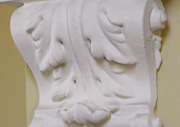 Decorative molding made of plaster that is in several of the hallways of the house. The molding is in archways on the first and second floors in the main halls.