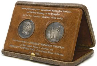 A brown box that has the appearance of being made from snakeskin; box opens up and medals swing out to prop the top up as a display case; two medals inside-one is intended for the President of the United States of America and the other is intended for the President of the United States of Mexico. Marked: 