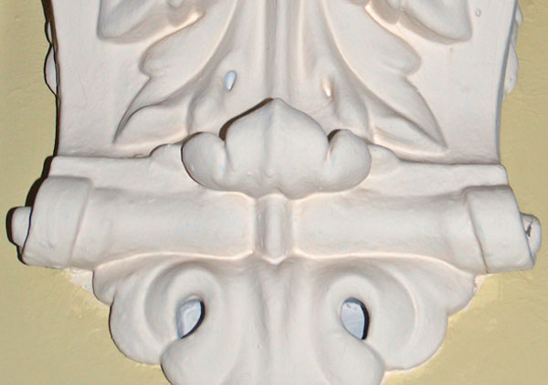 Decorative molding made of plaster that is in several of the hallways of the house. The molding is in archways on the first and second floors in the main halls.