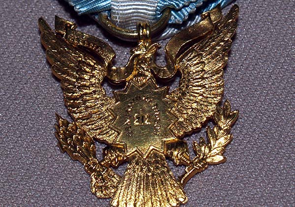 The back of the badge in the center reads 